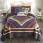 Colors in this quilt include brick red, rose, crimson, navy, country blue, antique yellow, gold, forest green, and olive.