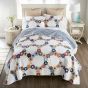 The Prairie Cotton Quilt Set colors, include: navy, soft yellow, pale blue, white, khaki, and red, come together in a stunning symphony of shades.