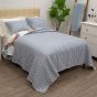 Prairie Cotton Quilt Set reverses to a beautiful blue and white gingham plaid design. 