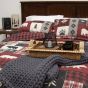 Lifestyle image of Donna Sharp Bear Peak Cotton Quilt Set featured with the Charcoal Chunky Knit Throw.