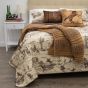 Lifestyle image of Donna Sharp Cowboy Cotton Quilt Set featured with the Camel Plush Knit Throw.