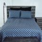 This comforter reverses to a grey and blue buffalo check pattern.