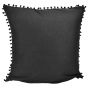 The back of this pillow is solid black with tiny pompoms on the edges.