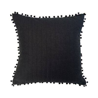 The front of this pillow has straight line stitching with tiny pompoms on the edges.