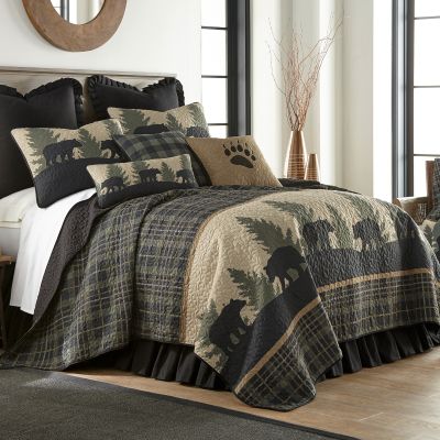 Bear Walk Plaid features a row of printed black bears and pine trees surrounded by a plaid backdrop.