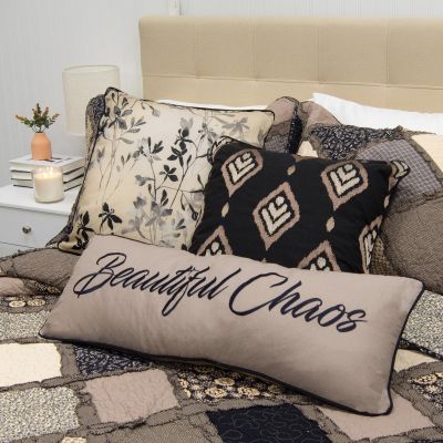 This pillow features black and grey florals.