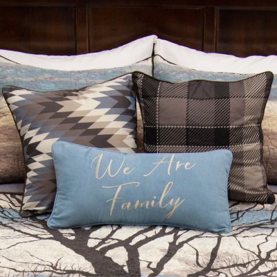 This plaid decorative pillow features browns and tans.