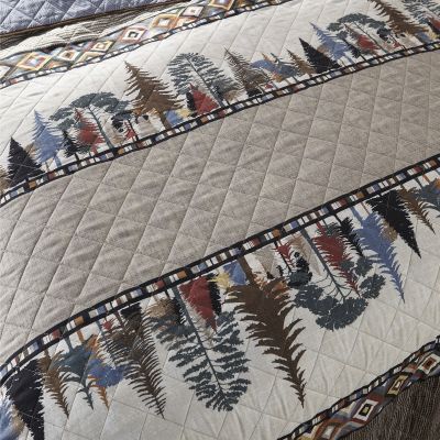 This quilt set features a multicolor tree line with geometric motifs.