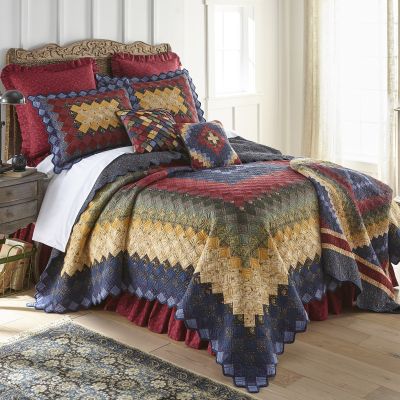 Colors in this vibrant quilt include red, blue, and yellow.