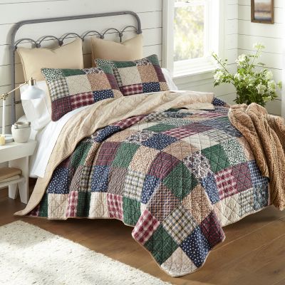 Rustic Paisley Cotton Quilt Set from Donna Sharp. Set includes 1 quilt and two shams. Plush Knit throw shown in camel, sold separately.