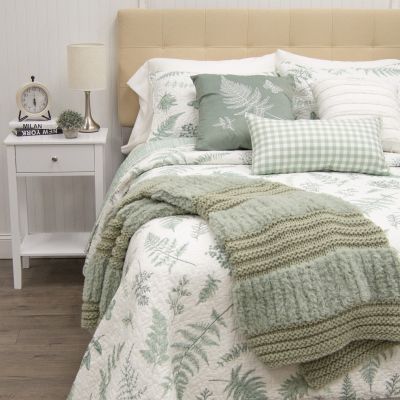This charming cotton bedding ensemble from Donna Sharp displays an array of peaceful sage-colored ferns, butterflies and assorted leaf motifs on a white background.