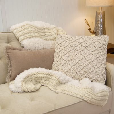 This rectangular pillow is camel-colored with fringe detail.