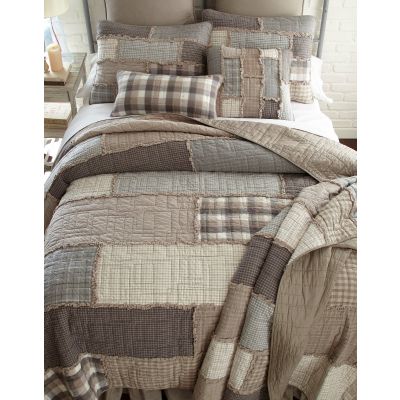 This quilt features soft woven plaids in neutral colors.