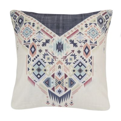 this dec pillow features a striped Southwest pattern which is printed with a woven texture. Colors include smoky shades of navy, slate grey, ivory, peach and cream