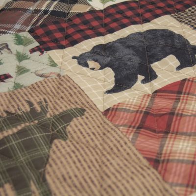 The wildlife motifs are arranged in a plaid patchwork.