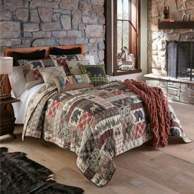 The quilt set comes with 2 shams in a FREE tote bag. 
Also featured in this image are the coordinated décor pillows and the rust chenille knitted throw.