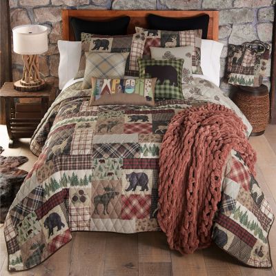 The quilt set comes with 2 shams in a FREE tote bag. 
Also featured in this image are the coordinated décor pillows and the rust chenille knitted throw.