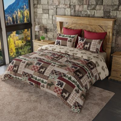 this comforter displays a variety of deer, moose, bear and pine motifs, arranged in a plaid patchwork.  