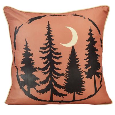 This fun decorative pillow is orange with a forest silhouette and crescent moon.