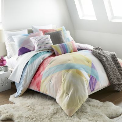 The Prism comforter has large, watercolor-inspired designs with angular geometric shapes.