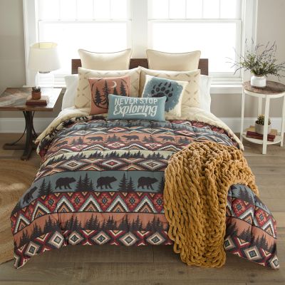 Bear and pine tree silhouettes alternate throughout comforter.