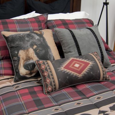 This fun decorative pillow features a black bear.