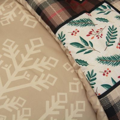 Woodland Holiday Comforter Set in a Christmas themed bedroom. Set includes two coordinating pillowcases. Images on pillowcases may vary. Accessories sold separately.