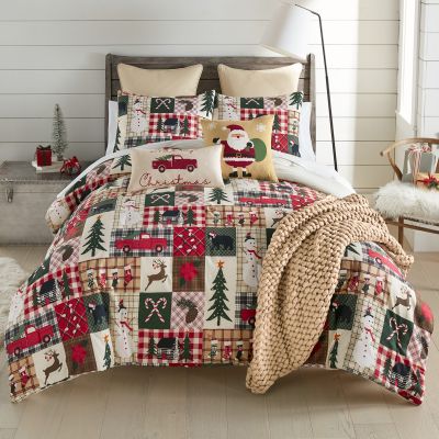 Holiday Dream Comforter Set from Your Lifestyle by Donna Sharp showcases a captivating hopscotch pattern adorned with a whimsical array of winter holiday motifs and forest animals. Decor Pillows and accessories sold separately.