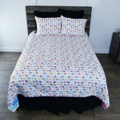 This fun quilted bedding set has a brush stroke pattern in blush, peach, soft fuchsia, and aqua. 