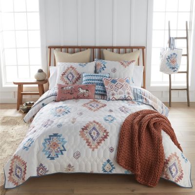 Bonita Southwest quilt colors include terra cotta, turquoise, dusty purple, and off white.