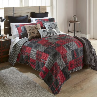 Colors in this quilt include black, red, and shades of grey.