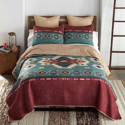 quilt set,  teal green , cream, black and  burgundy and tan colors. southwest pattern across middle of quilt. 