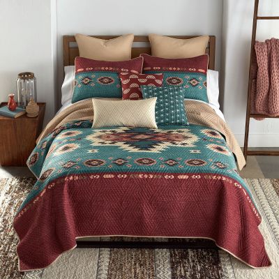 quilt set, teal green, cream, black and  burgundy and tan colors. southwest pattern across middle of quilt. 